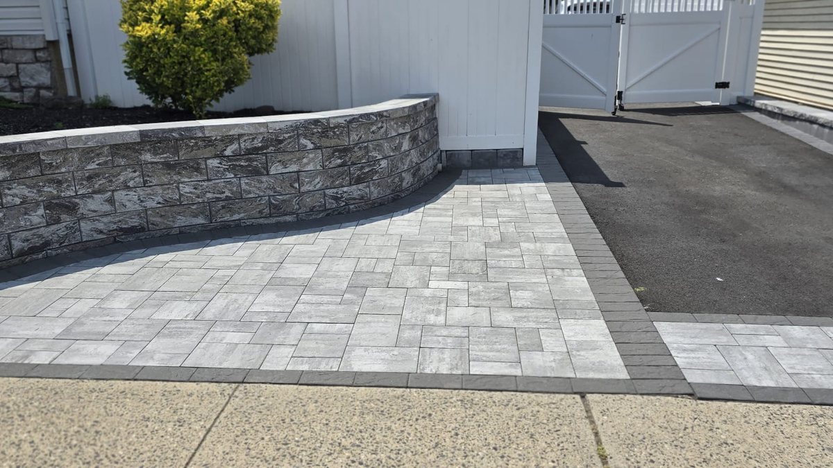 Completed paver driveway and walkway surface by RMR & Brothers